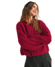 Woman wearing a red cardigan on a white background