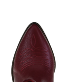 Close-up of a red cowboy boot with detailed stitching on a white background