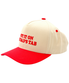 Beige and red cap with text on a white background