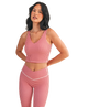 Woman wearing a red and white GINGHAM checkered tank on a white background