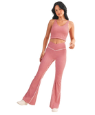 Woman wearing a red and white GINGHAM checkered tank on a white background