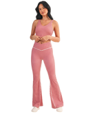 Woman wearing a red and white GINGHAM checkered tank on a white background