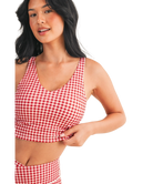 Woman wearing a red and white GINGHAM checkered tank on a white background
