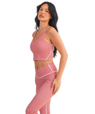 Woman wearing a red and white GINGHAM checkered tank on a white background