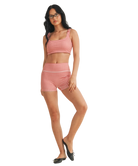 Woman wearing a red and white GINGHAM checkered tsports bra on a white backgrounD