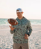 Person wearing a RETRO DUCK camouflage hoodie on a white background