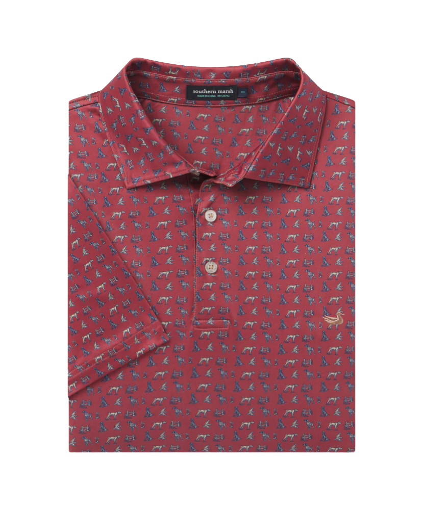 Red polo shirt with dog pattern on a white background