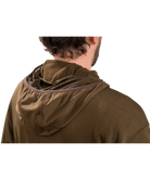 Person wearing a brown hooded jacket with a checkered lining on a white background