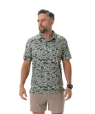 Man wearing a camouflage-patterned polo on a white background