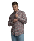 Man wearing a plaid shirt on a white background