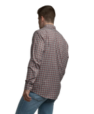 Man wearing a plaid shirt and jeans on a white background