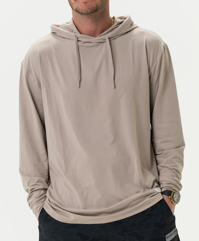 Man wearing a beige hoodie on a white background