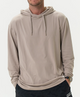 Man wearing a beige hoodie on a white background