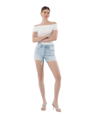 Woman wearing light blue denim shorts on a white background