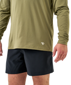 Man wearing a green hoodie on a white background