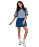 Woman wearing a blue and white striped top and skirt on a white background