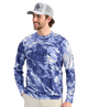 Man wearing a blue camouflage long-sleeve shirt with HUK logo on a white background