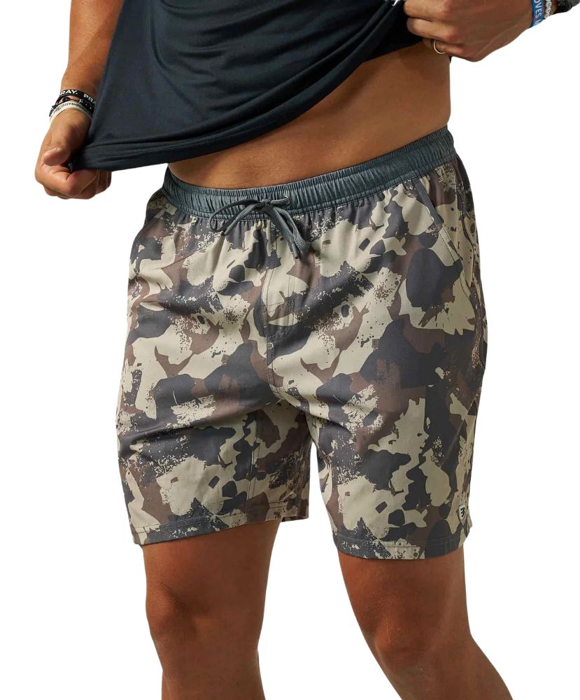 A person wearing camouflage athletic shorts and lifting a black shirt, shown from the chest to the upper thighs against a plain white background.