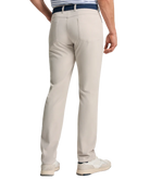 Stone Genteal pants worn by a person on a white background