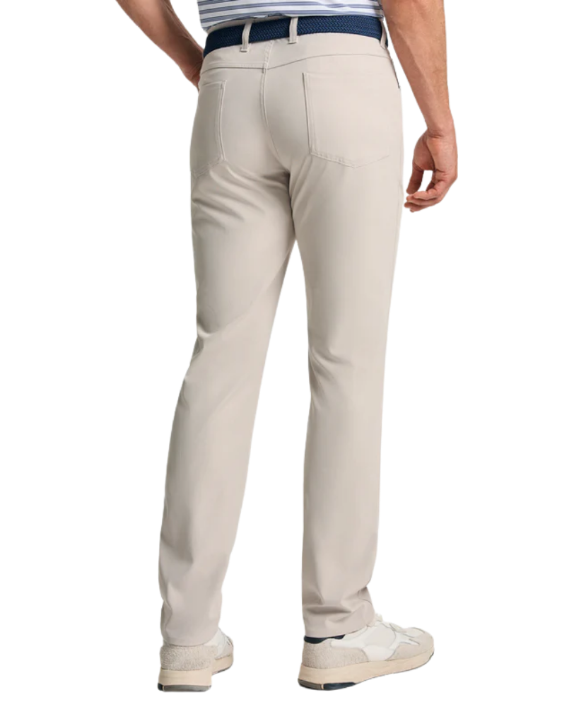 Stone Genteal pants worn by a person on a white background
