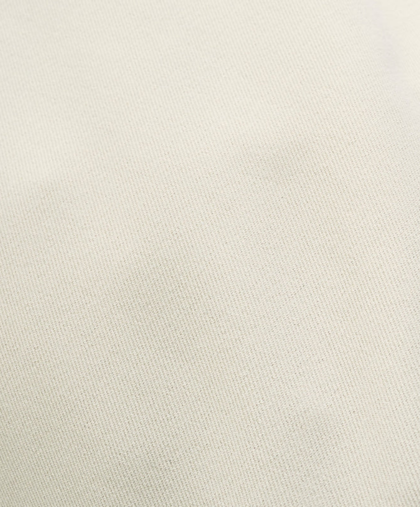 Close-up of a textured light gray fabric pants