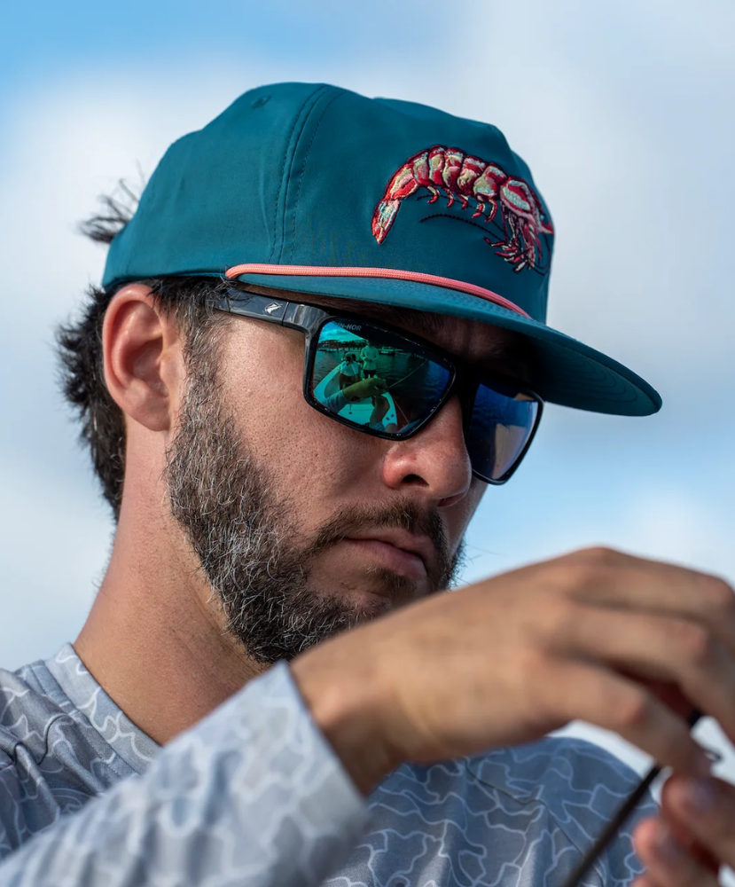 Teal LOCAL BOY cap with a shrimp design on a white background