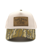 Cap with camouflage bill and 'True South' leather patch on a white background