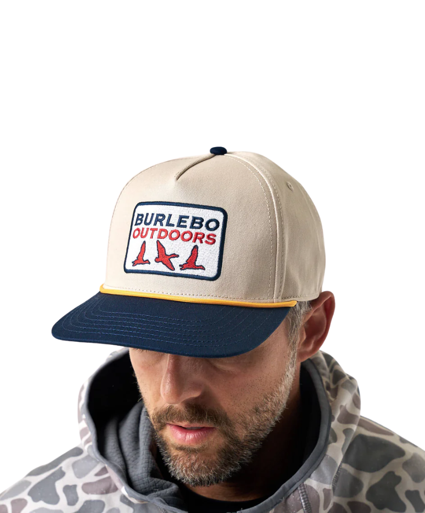 Man wearing a beige and navy cap with 'Burlebo Outdoors' logo on a white background