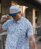 Man wearing a Burlebo cap outdoors