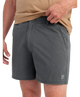 Person wearing gray HUK shorts on a white background