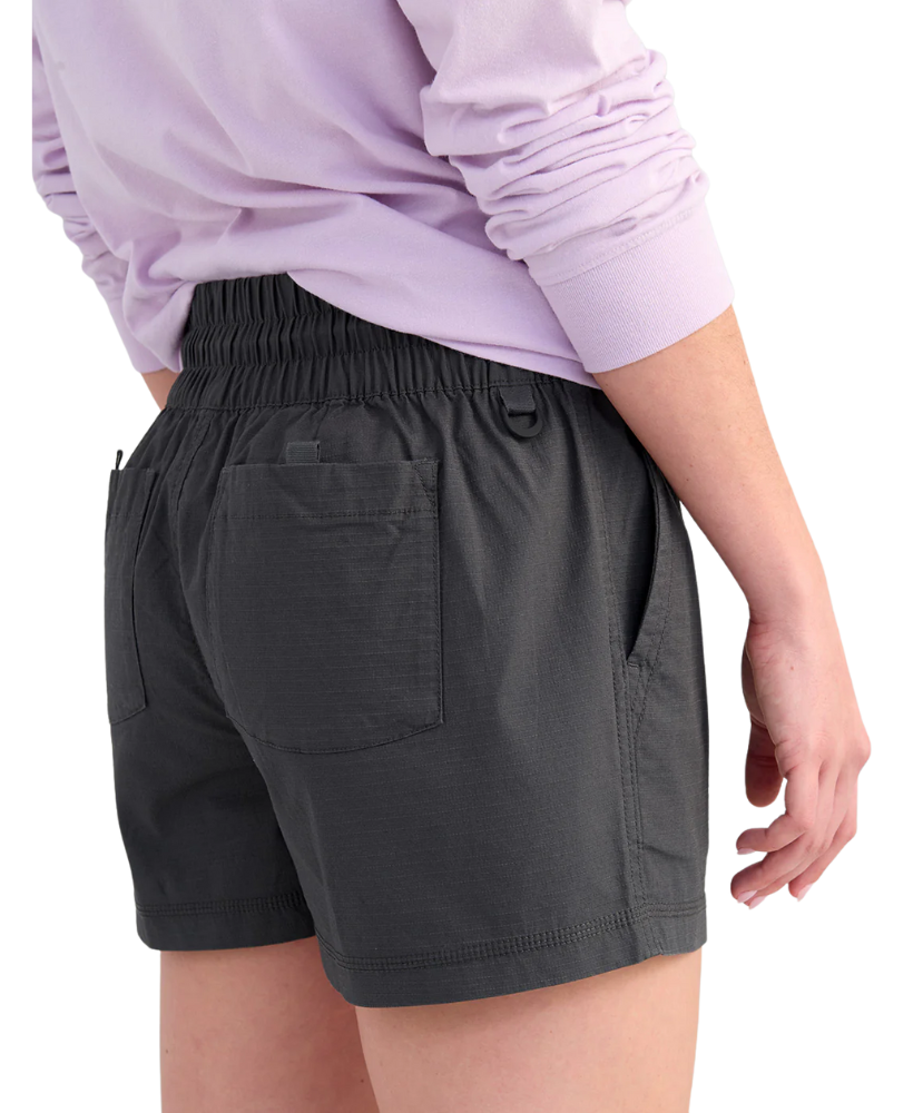 Woman wearing black shorts with a drawstring and front pocket on a white background