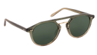 Sunglasses with green lenses and gold frames on a white background