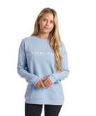 Woman wearing a light blue sweatshirt with 'Southern Marsh' text on a white background