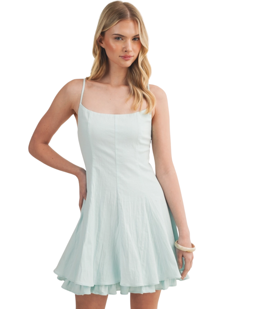 Woman wearing a light blue dress on a white background