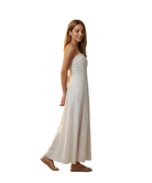 Woman wearing a white and beige striped dress on a white background