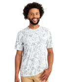 Man wearing a white t-shirt with a pattern on a white background