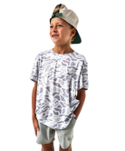 Child wearing a white camouflage t-shirt and light gray shorts on a white background