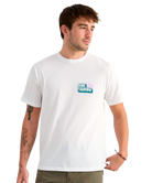 Man wearing a white t-shirt with a HUK logo on a white background