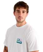 Man wearing a white t-shirt with a HUK logo on a white background