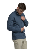 Man wearing a textured blue quater-zip on a white background
