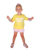 Young girl wearing a yellow 'Orange Beach' shirt with pink shorts on a white background