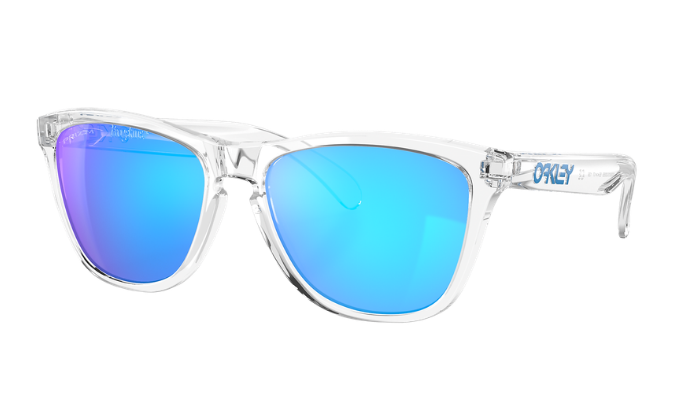 Oakley sunglasses with a clear transparent frame and vibrant blue mirrored lenses, shown on a solid white background.
