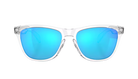 A pair of Oakley Frogskin sunglasses with a clear, semi-transparent frame and vibrant blue mirrored lenses, shown against a solid white background.