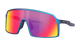 Oakley wraparound sunglasses with a blue frame and a large shield lens featuring a red-to-yellow mirrored gradient.