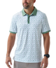 Man wearing a white duck and waterfowl patterned polo shirt with green accents on a white background