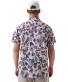 Man wearing a vintage camo patterned short-sleeve button down shirt on a white background
