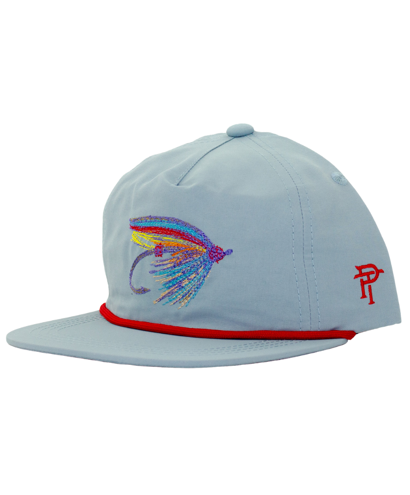 Light blue cap with colorful fish lure design and red band on a white background