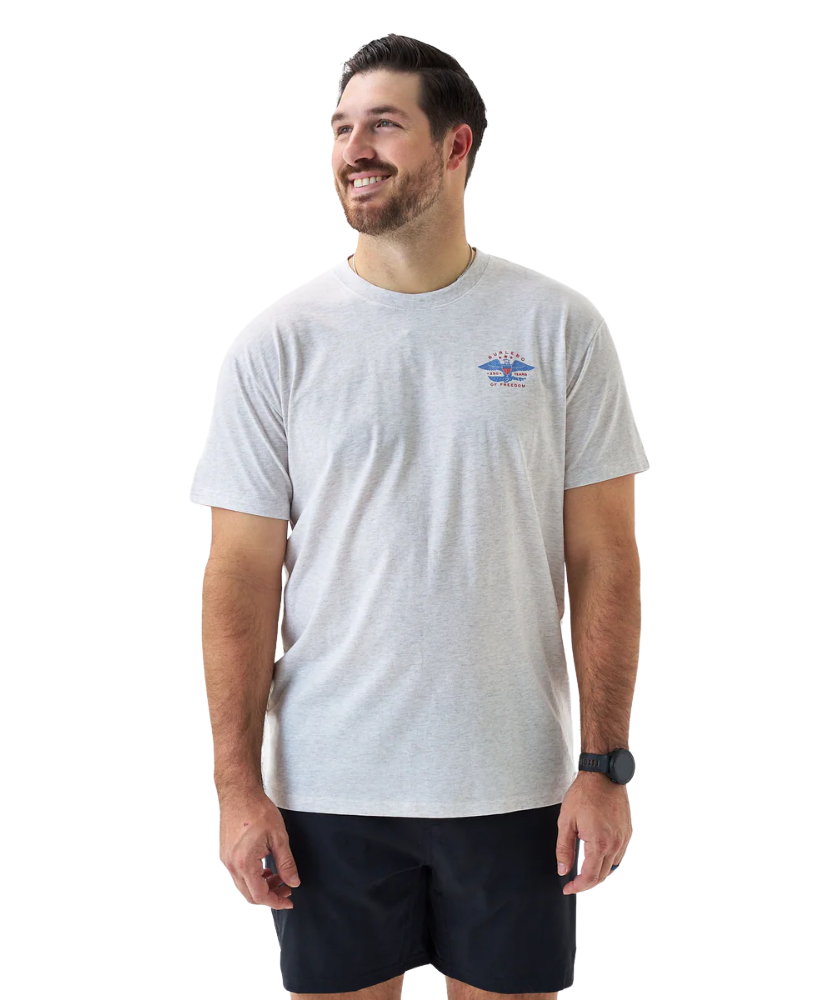 Man wearing a gray t-shirt with a logo on a white background
