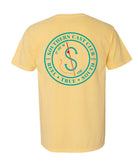 A pale yellow short-sleeve t-shirt shown from the back, featuring a large teal circular graphic with a compass and the words 'SOUTHERN CAST CLUB' and 'KELLY • TRUE • SOUTH'.
