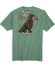 A green colored t-shirt with a graphic of a dog and the text 'Local Boy Outfitters' on the back.